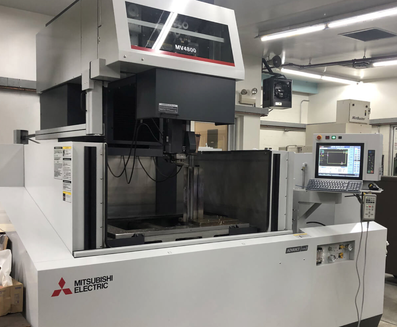 WireEDM_machine Brodeur wire edm services achieve tolerances as tight as 0.0001”